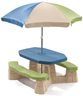 Naturally playful picnic table with umbrella