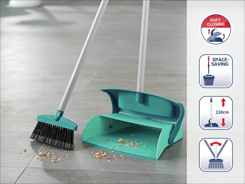 Sweeping set with handle and dirt container.